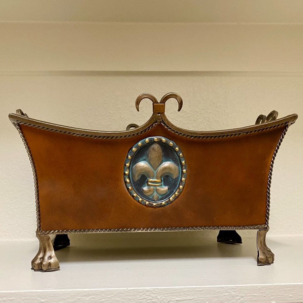 Decorative metal fleur-de-lis planter/container.